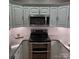 Modern kitchen with granite countertops and stainless steel appliances at 3645 Lake Bluff Dr, Sherrills Ford, NC 28763