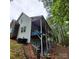 House exterior showcasing a large deck and wooded backyard at 3645 Lake Bluff Dr, Sherrills Ford, NC 28763