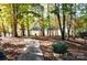 Wooded backyard with lake view and walkway at 3645 Lake Bluff Dr, Sherrills Ford, NC 28763