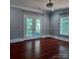 Bedroom with hardwood floors and French doors leading to a deck at 3645 Lake Bluff Dr, Sherrills Ford, NC 28763