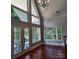 Living room with hardwood floors, large windows, and a chandelier at 3645 Lake Bluff Dr, Sherrills Ford, NC 28763