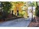 Ornate black metal gate leading to a private driveway at 3645 Lake Bluff Dr, Sherrills Ford, NC 28763