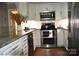 Modern kitchen with granite countertops and stainless steel appliances at 3645 Lake Bluff Dr, Sherrills Ford, NC 28763