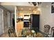 Kitchen and dining area with glass table and black appliances at 3645 Lake Bluff Dr, Sherrills Ford, NC 28763