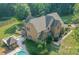 Aerial view showcasing home's exterior, pool, and gazebo at 1228 Brawley School Rd, Mooresville, NC 28117