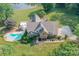 Two story home, pool, and landscaped yard at 1228 Brawley School Rd, Mooresville, NC 28117