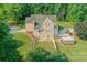 House with pool and deck in wooded area at 1228 Brawley School Rd, Mooresville, NC 28117