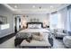 Serene bedroom with gray walls, a comfortable sitting area, and plenty of natural light at 11318 James Coy Rd # Devonshire, Davidson, NC 28036