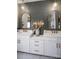 Elegant bathroom with double vanity, gold fixtures, and a stunning tile backsplash at 11318 James Coy Rd # Devonshire, Davidson, NC 28036