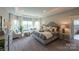 Spacious main bedroom with sitting area and large windows offering ample natural light at 11318 James Coy Rd # Devonshire, Davidson, NC 28036