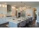 Modern kitchen with white cabinets, a large island, and globe pendant lights at 11318 James Coy Rd # Devonshire, Davidson, NC 28036