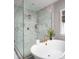 Spa-like bathroom featuring a large walk-in shower and a luxurious soaking tub at 11318 James Coy Rd # Devonshire, Davidson, NC 28036