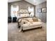 Cozy bedroom with vaulted ceiling, neutral decor, and a comfortable sitting area at 11318 James Coy Rd # Devonshire, Davidson, NC 28036