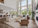 Open-concept living room with a large sectional sofa and access to the kitchen at 11318 James Coy Rd # Devonshire, Davidson, NC 28036