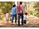 Gathering enjoying a walk on a wooded path, showcasing the neighborhood's natural beauty at 11318 James Coy Rd # Devonshire, Davidson, NC 28036