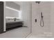 Spa-like bathroom with double vanity and a large walk-in shower at 9901 Benfield Rd # 322, Charlotte, NC 28269