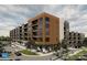 Modern apartment building with retail space on the ground floor at 9901 Benfield Rd # 322, Charlotte, NC 28269