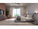 Bright and spacious bedroom with brick feature wall and large windows at 9901 Benfield Rd # 322, Charlotte, NC 28269