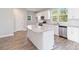 Modern kitchen with white cabinets, granite counters, and stainless steel appliances at 1030 Heath Helms Rd, Monroe, NC 28110