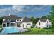 Luxury home with a large pool, patio, and outdoor kitchen area at 8014 Litaker Manor Ct, Charlotte, NC 28270