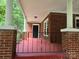Front porch with brick columns and red flooring at 4210 Old Beatty Ford Rd, China Grove, NC 28023