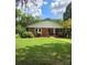 Brick ranch house with covered porch and landscaped yard at 4210 Old Beatty Ford Rd, China Grove, NC 28023