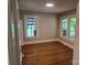 Bedroom with hardwood floors and multiple windows at 4210 Old Beatty Ford Rd, China Grove, NC 28023