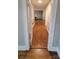 View down a hallway with wood-look flooring at 4210 Old Beatty Ford Rd, China Grove, NC 28023