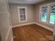 Bedroom with hardwood floors and two windows at 4210 Old Beatty Ford Rd, China Grove, NC 28023