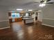 Spacious kitchen featuring an island, ample cabinetry, and wood-look flooring at 4210 Old Beatty Ford Rd, China Grove, NC 28023