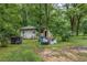 Large backyard with sheds and some yard debris at 440 N Oakland Ave, Statesville, NC 28677