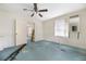 Bedroom with light blue walls, carpet, and ceiling fan at 440 N Oakland Ave, Statesville, NC 28677