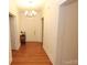 Clean hallway with hardwood floors and light walls at 110 Sinclair Ln, Wadesboro, NC 28170