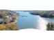 Aerial view of a lakefront community with marina and waterfront homes at 112 Sycamore St, New London, NC 28127