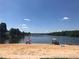 Sandy beach area on lake with boat docks and swimming at 112 Sycamore St, New London, NC 28127