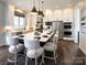Bright kitchen featuring white cabinets, a large island, and hardwood floors at 841 Lake Forest Dr # Hawthorne, Belmont, NC 28012