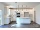 Modern kitchen featuring white cabinets, granite countertops, and a large island at 841 Lake Forest Dr # Hawthorne, Belmont, NC 28012