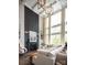 Bright living room showcasing a sectional sofa, fireplace, and abundant natural light at 841 Lake Forest Dr # Hawthorne, Belmont, NC 28012