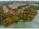 Aerial view of lakefront community with new homes and undeveloped lots at 831 Lake Forest Dr # Savanh, Belmont, NC 28012