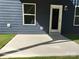 Small concrete patio adjacent to house with grass at 230 Hamrick Rd # 2, Cramerton, NC 28032
