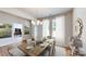 Virtually staged dining room with wood table and chairs at 230 Hamrick Rd # 2, Cramerton, NC 28032