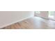 Unfinished basement room with wood-look floors and sliding glass door at 230 Hamrick Rd # 2, Cramerton, NC 28032