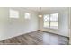 Bright dining room with hardwood floors and large windows offering natural light at 8631 Frank Grier Rd # 6, Charlotte, NC 28215