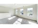 Spacious bedroom with grey carpet and large windows at 8631 Frank Grier Rd # 6, Charlotte, NC 28215