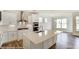 Modern kitchen with white cabinets, stainless steel appliances, and a large island at 8631 Frank Grier Rd # 6, Charlotte, NC 28215