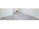 Spacious bedroom with grey carpet and door access at 8631 Frank Grier Rd # 6, Charlotte, NC 28215