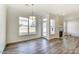 Spacious dining area with hardwood floors, fireplace, and access to backyard at 8631 Frank Grier Rd # 6, Charlotte, NC 28215