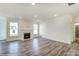 Spacious living room with fireplace and hardwood floors at 8631 Frank Grier Rd # 6, Charlotte, NC 28215