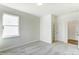 Well-lit bedroom featuring grey carpet and two doors at 8631 Frank Grier Rd # 6, Charlotte, NC 28215