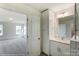 Well-appointed bathroom with vanity, storage, and access to bedroom at 8631 Frank Grier Rd # 6, Charlotte, NC 28215